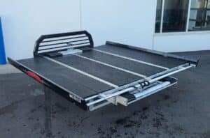 rear 3/4 view of black aluminum sport deck on the ground
