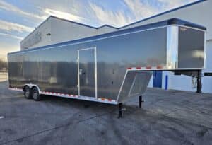 front 3/4 of top line goose neck enclosed car hauler trailer