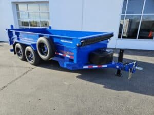 front 3/4 view of blue dump trailer