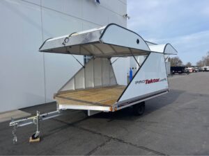 side view of Protektor 2 Place Snowmobile Trailer with both front and back doors open